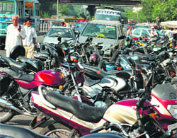 A view of vehicles parked haphazardly in a Jammu market. Besides obstructing free flow of traffic, this causes frequent accidents.