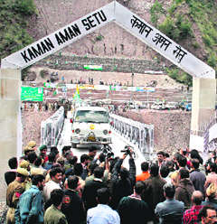 Trucks carrying goods from Muzaffarabad (PoK) cross the LoC at Kaman post in Uri on Tuesday.