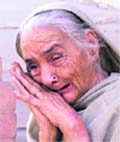 Parkash Kaur cries for her dead son on the occasion of the Police Commemoration Day in Ludhiana 