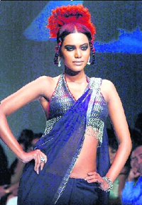 A model displays designers Nikhil & Shantanu's creation on the first day of Lakme Fashion Week in Mumbai.