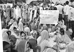 Students of Baba Banda Singh Bahadur Engineering College, Fatehgarh Sahib, hold a protest on Wednesday. 