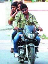Youngsters, blatantly flouting traffic rules, are a common sight in the city.