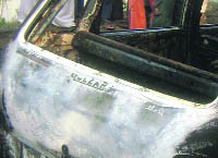 Gulzar inscribed on the rear of the Zen car helped the police to identify the youth who was charred to death on Wednesday.