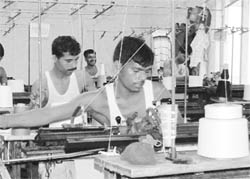 Migrants working in a hosiery factory.
