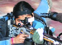 A participant takes an aim in the 33rd Chandigarh State Shooting Championship at the Sector 25 shooting range  in Chandigarh