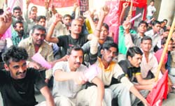 Safai karamcharis stage a protest in support of their demand for Diwali bonus at Government Medical College and Hospital, Sector 32, Chandigarh