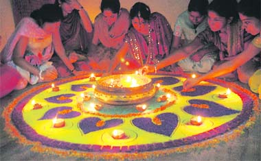 Students of the International Institute of Fashion Technology, Mohali, participate in a rangoli competition