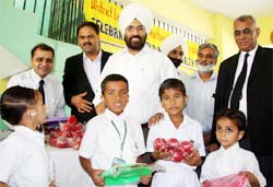 District and sessions judge Kuldeep Singh distributing sports kits among the students of Mahant Gurbanta Das School for Deaf and Dumb children in Bathinda