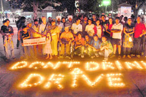 Volunteers of Arrive safe and AIESEC take part in a candle-light safe-drive awareness programme in Sector 17, Chandigarh, on Tuesday.