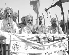 Panj Pyaras participate in a nagar kirtan on the occasion of 300 years of Gurta Gaddi Divas celebrations near Shambhu in Ambala on Saturday.