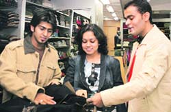 Youngsters pick out jackets at a store in Ludhiana. Photo: Rajesh Bhambi