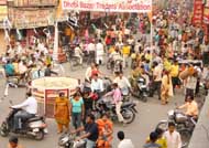 With only days left for Diwali, the festival of lights, residents of Bathinda throng the Dhobi Bazaar to make purchase on Sunday; and (right) City residents buying utensils on Dhanteras, celebrated on Sunday.