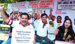 Members of Save Family Foundation and NGOs hold a dharna to protest against the misuse of women protection laws