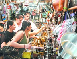 People purchase utensils at Sarojini Nagar Market on 'Dhanteras' in New Delhi
