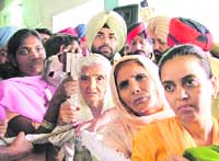 Complainants wait in a queue to meet the Chief Minister in Ludhiana