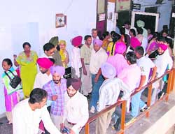 BEd teachers wait for DEO Sudesh Bajaj in front of her office in Ludhiana.