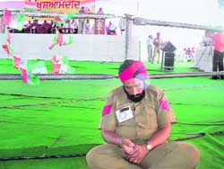 A cop catnaps during the visit of the then chief minister, Capt Amarinder Singh, while the speaker addresses the gathering.