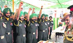 GOC-in-C, Western Command, Lt Gen T.K. Sapru (right) with troops at a Sainik Sammelan organised to commemorate the Infantry Day in Chandimandir on Monday. 