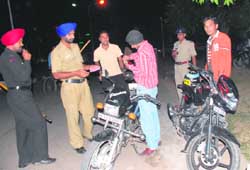 Police personnel check documents of vehicles during a special naka at Sector 23, Chandigarh