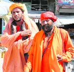 Snake charmers with a python roam around freely in Hamirpur.