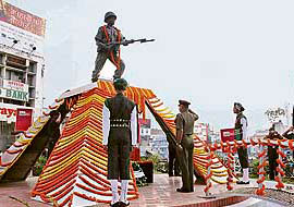 Soldiers pay respect to their fallen colleagues during a ceremony to mark Infantry Day on Monday.