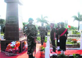 An Army officer salutes in front of the Infantry Memorial at the Mamun Cantonment in Pathankot