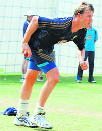 Speed Demon: Australias Brett lee gets ready to bowl during a training session at the Feroz Shah Kotla Ground in New Delhi on Monday.