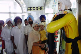 Devotees at the temple of Baba Kala Mehar at village Sikhanwala in district Faridkot on Wednesday.