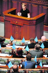 Ukrianian Prime Minister Yulia Tymoshenko addresses deputies at Parliament in Kiev on Wednesday. It approved a package of legislation demanded by the International Monetary Fund to release an emergency loan worth $16.5 billion in the first of two readings. 