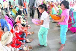 Young devotees distribute langar on Vishwakarma Day at Ramgarhia Bhawan in Mohali