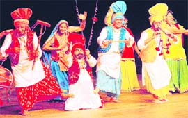 Artistes perform bhangra on the inauguration of Tagore Theatre in Sector 18, Chandigarh