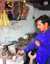 Raja Ram offers prayers at a workshop in Ambala on the occasion of Vishwakarma Day