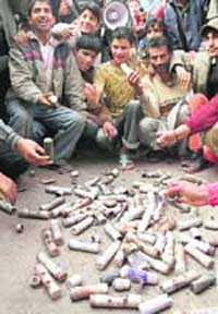 Residents of Saidapora Achan display used tear gas shells fired by security forces during protests over garbage dumping on Wednesday. 