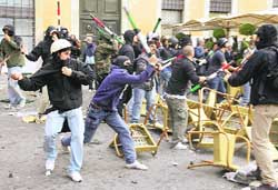 Students from left and right wing blocs clash in Piazza Navona during a protest against a senate vote on educational reforms in Rome on Wednesday.