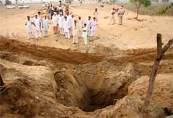 The borewell in which two people were killed when they fell in it after the soil caved in