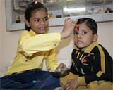 A girl applies tilak on the forehead of her brother on the occasion of Bhai Dooj in Bathinda