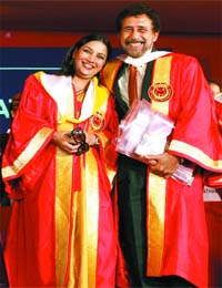 Actors Shabana Azmi and Naseeruddin Shah pose after receiving doctorate degree from Jamia Millia Islamia in New Delhi