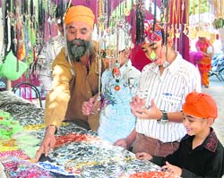 Devotees shop at Gurdwara Govind Nagar in Dehradun on Thursday. 