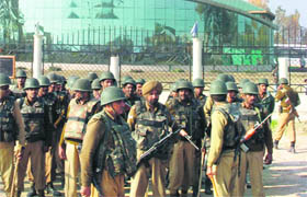 Security personnel stand guard outside Haj House.