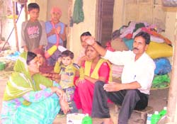 Sanjay Kumar, the caretaker of Thapar Agro Mill, with his family. 