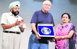 Principal Charanjit Kaur Mahal and Gurbir Singh, president of the school, honour the mayo
