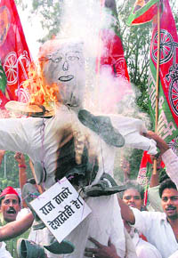Samajwadi Party activists burn an effigy of MNS chief Raj Thackeray during a demonstration in Lucknow on Thursday, to protest against the attacks on north Indians in Maharashtra.