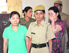 Two Chinese women, who were arrested on a charge of staying in the country without a valid passport and visa, in the custody of the Gurgaon police on Friday.