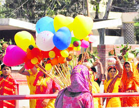 Women take part in a kalash yatra on the start of the Chhat Puja function in Karnal on Friday.