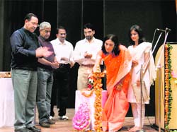 Prof. Meenakshi Jain of the Department of Architecture lighting the lamp on the inauguration of national workshop on hill development at NIT, Hamirpur, on Friday.