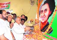 PPCC chief Mohinder Singh Kaypee and Bathinda MLA Harminder Singh Jassi with others offer flowers to the portrait of former Prime Minister Indira Gandhi at a Sankalp Diwas function in Bathinda on Friday; and (right) Ajaib Singh Bhatti, MLA, Nathana, Makhan Singh, MLA, Pakka Kalan, Gurpreet Singh Kangar, MLA, Phul, and Mangat Ram Bansal, MLA, Budhladha, after welcoming Kaypee choose not to attend the function.