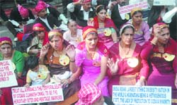 Codava tribal women with activists of Codava National Council protest against the proposed Suvarna celebrations by the Karnataka government, at Jantar Mantar in New Delhi