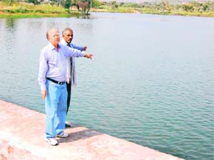 R. N. Malhotra, member of the PHD Chambers of Commerce and Industry, at a man-made lake in Sawalpur village in Sikar district of Rajasthan