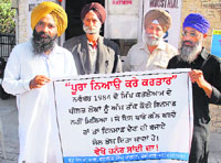 Victims of 1984 riots outside the gurdwara in Sector 40, Chandigarh.
