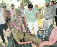 H.S. Doon SP (Traffic) inspects the spot, along with other police officials, where a constable was found dead in a park in Sector 39, Chandigarh, on Sunday morning.
